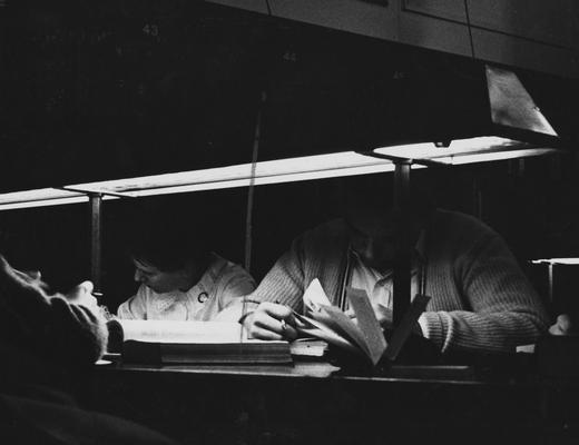 Students studying at night in the Breckinridge Room of King Library