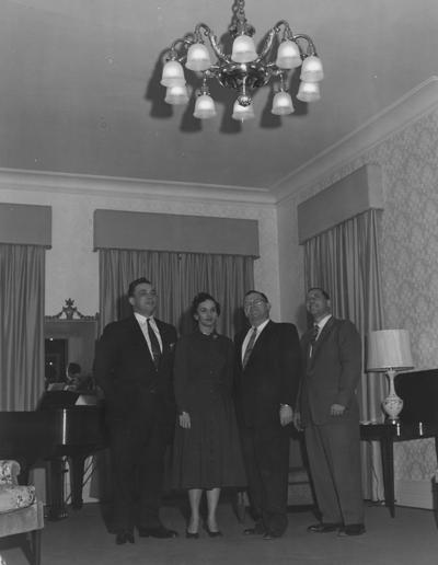 Inside Maxwell Place; Mrs. Frank G. Dickey with three men- the man to her right may be Mr. Hillenmeyer. Received January 5, 1947 from Public Relations