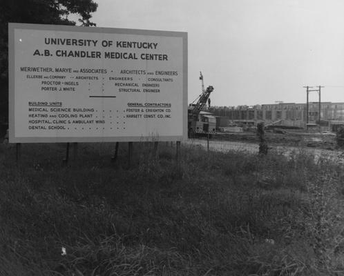 Medical Center construction with a sign that lists the architects, engineers, building units, and the general contractors for the different building units. Received August 16, 1958 from Public Relations