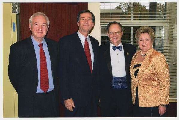 President Lee Todd (second from right), Patsy Todd (right), an unidentified man, and John Yopp(left) are at a ceremony for the reopening of the Main Building