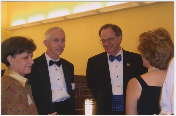 From the left:  Pam Moore (spouse of Roy Moore), Roy Moore, and President Lee Todd.  They are at a ceremony for the reopening of the Main Building