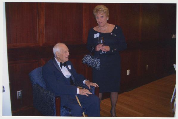 Dr. Thomas Clark and Board of Trustees member Alice Sparks are at a ceremony for the reopening of the Main Building