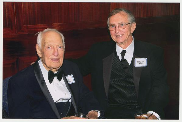 Dr. Thomas Clark and Billy Joe Miles (Chairman of the Board of Trustees)  are at a ceremony for the reopening of the Main Building