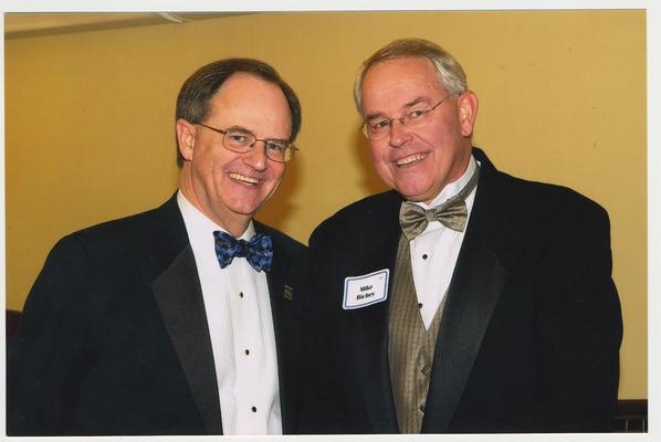 President Lee Todd and Mike Richey are at a ceremony for the reopening of the Main Building