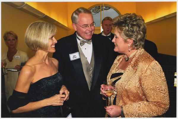 From the left:  Susan Richey, Mike Richey, and Patsy Todd.  They are at a ceremony for the reopening of the Main Building