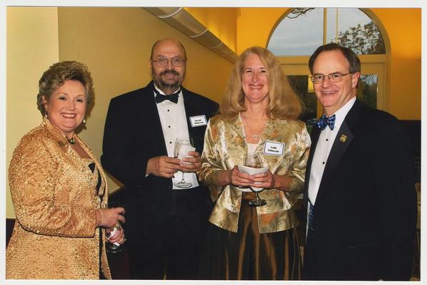 From the left:  Patsy Todd, David Johnson, Sally Johnson, and President Lee Todd.  They are at a ceremony for the reopening of the Main Building