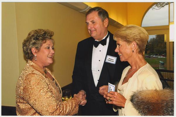 From the left:  Patsy Todd, Thomas Robinson, and Helen Robinson.  They are at a ceremony for the reopening of the Main Building