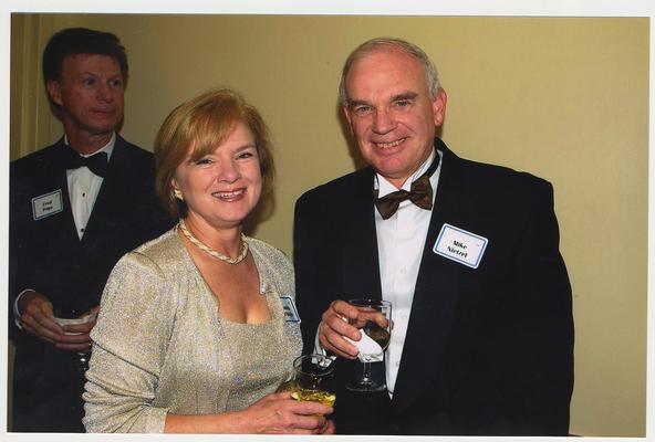 Mike Nietzel (Provost of UK) and Sandra D'Angelo (spouse) are at a ceremony for the reopening of the Main Building. Fred Pope is in the background