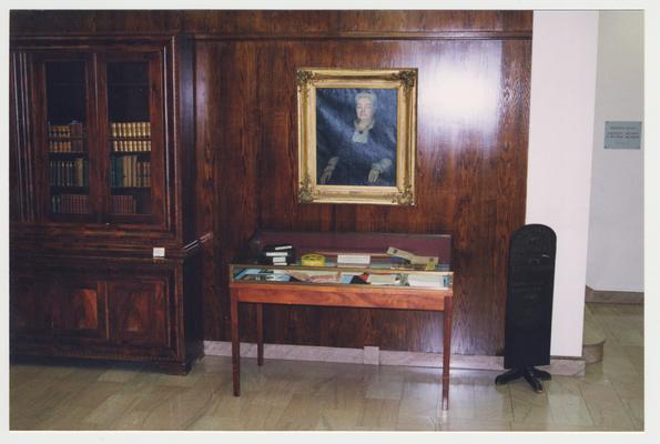 The lobby of the M. I. King Library.  There is a portrait of Laura Clay over an exhibit case