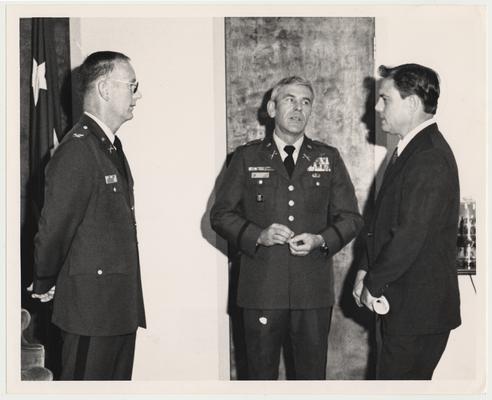 Professor Vince Davis (right), Director of the Patterson School, is at the National War College in Washington DC.  The man in the middle is the two-star commandant with his aide on the left.  David was a guest lecturer