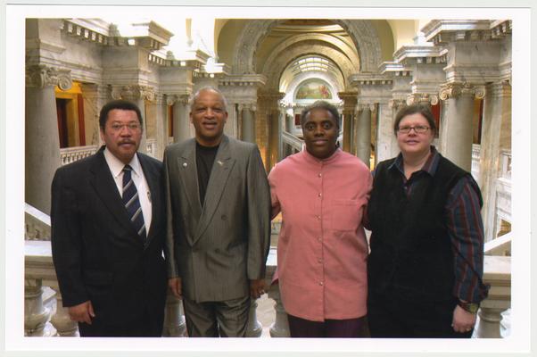 From the left:  Kentucky Representative Jesse Crenshaw;  Cecil R. Madison, Sr., of UK Libraries; Reinette F. Jones, UK Libraries; and Kathy Schiflett, Administrative Office of the Courts.  The photograph was taken in the Capitol