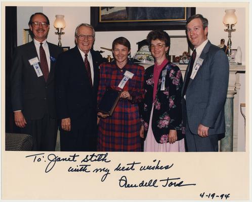 From the left:  an unidentified man; US Senator Wendell Ford; Janet Stith, director of the Medical Center Library; an unidentified woman; and an unidentified man.  The photograph is autographed, 
