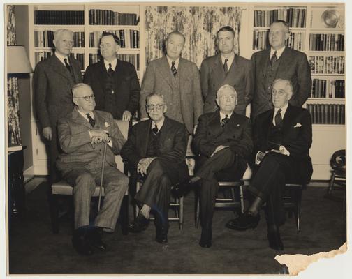 Back row from the left:  Samuel L. Wilson, Herman D. Donovan, Dr. J. S. Chambers, Thomas D. Clark, and J. Winston Coleman.  Front row from the left:  C. R. Staples, Dr. Claude Trapp, W. H. Townsend, and Dr. Frank McVey.  They are at the home of Thomas D. Clark, 248 Tahoma Rd., Lexington