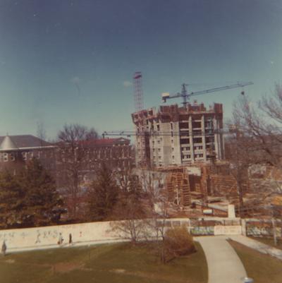 A color photo of the construction of White Hall Classroom Building (right) and Patterson Office Tower (next to White Hall) near the Administration Building (center) and Miller Hall (left). This photo was taken from the window in room 518 in King Library on April 1, 1968 and donated by Terry Warth