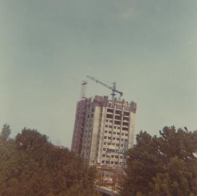 A color photo of the construction of White Hall Classroom Building (right) and Patterson Office Tower (next to White Hall). This photo was taken from the window in room 517 in King Library on July 30, 1968 and donated by Terry Warth
