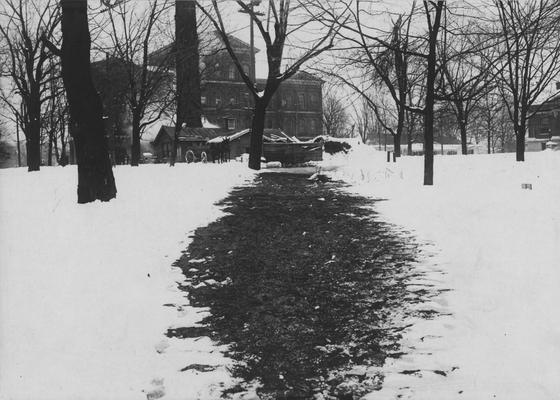 View above Steam Mains running from Heating Plant to Old Chemistry Building (Miller Hall). Path is clear of snow because of heat from underground pipes. Received January of 1953 from Dr. McVey's files