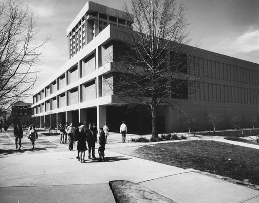 Unidentified students walking past the White Hall Classroom Building