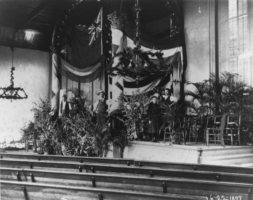 Administrative Building interior chapel decorated for the British Educational Mission Visit, June 22, 1897. Pews in chapel, palm plants decorated the chapel for this occasion. President Patterson was very excited to host the delegates