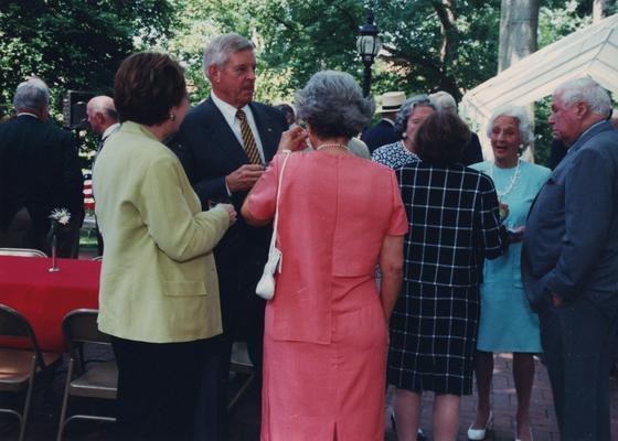 Celebration: July 11, 2002; Actual Birthday: July 16, 2002. Robert Milward and wife Eleanor, she is wearing an orange dress, and Dick Cooper is to the far right