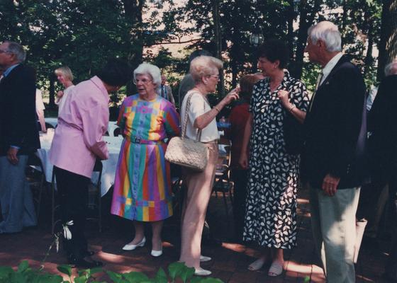 Celebration: July 11, 2002; Actual Birthday: July 16, 2002. Woman in the center holding a shoulder bag is Gloria Singletary speaking with George and Mrs. Zack, Director of Lexington Philharmonic Orchestra and Mrs. Rosenthal is in the multi-colored dress and is standing beside Gloria Singletary