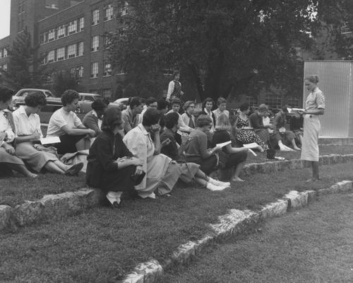 Orientation--students on steps behind Memorial Hall; the guide is Susan Haselden. Received December 20, 1957 from Public Relations