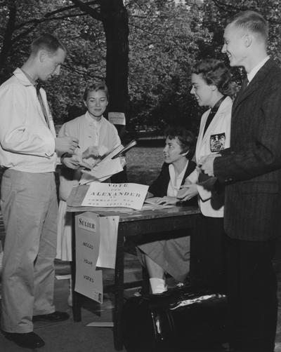 Students voting or getting information at the Alexander/Sulier table