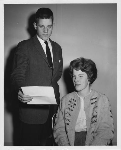 Two students looking at a letter of UK representatives