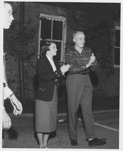 Margaret Futrell (left) and Dick Vimont (right) are talking outside