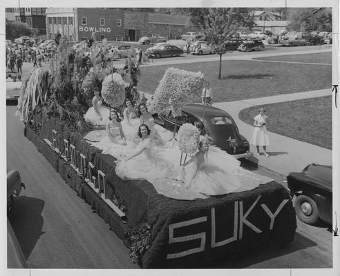 Homecoming Float with SUKY on the back. There are seven women on the float. Photographer: Mack Hughes