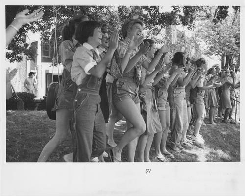 Members of Alpha Delta Pi social sorority welcome Fall rushees with a cheerful song in the 1980s