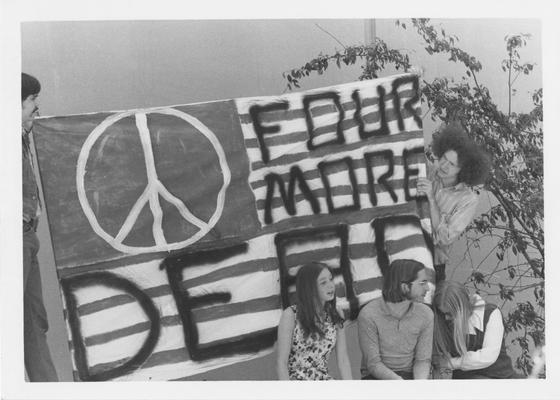 Students hold sign protesting the Kent State shootings