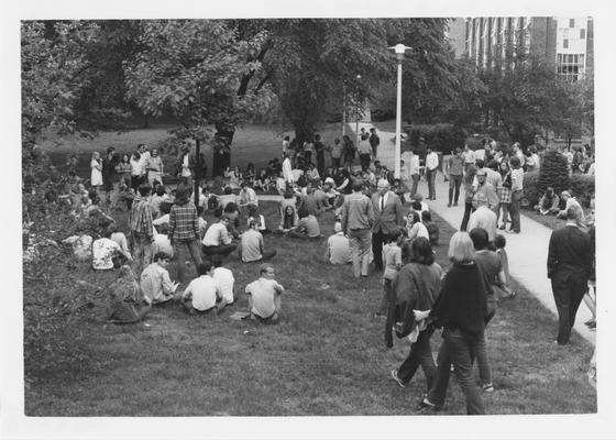 Protesters sitting on the lawn by the UK Student Center