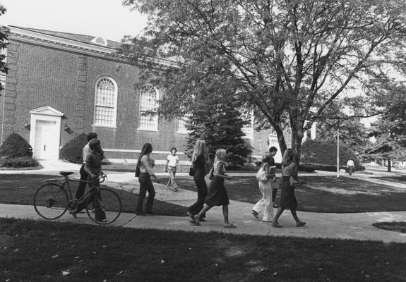 Students walk along the side of Memorial Hall