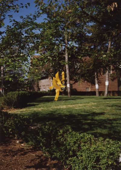 Sculpture beside Wendt Machine Shop on right and an engineering building (part of the 