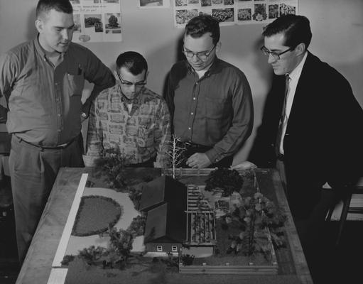 Discussing a residential landscape design model built by C. S. Buster and E. L. Westerfield are, from the left: Curtis Adams, London; Edward Donovan, Boone, Iowa; Lawrence Lose, Louisville; and Dr. J. W. Abernathie, assistant professor of horticulture and teacher of a class in landscape design