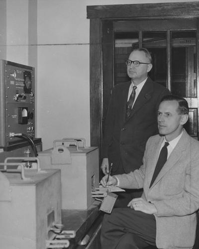 Radioisotope proportional counter; From left to right: Dr. Lyle R. Dawson, head of the Department of Chemistry and new staff member Dr. Kurt Starks