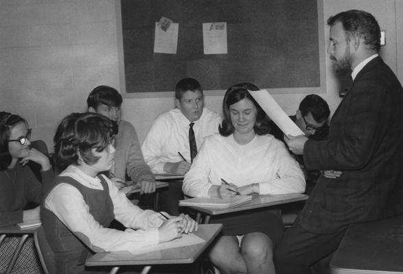 Professor Lee Pennington speaks to his students