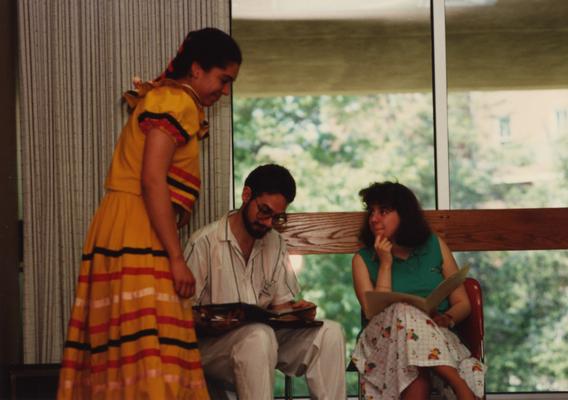 Tony Houston (center) judges a female student at the Foreign Language Festival, which was held in the Student Center on the University of Kentucky campus