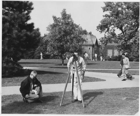 Men using equipment to survey