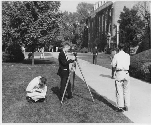 Men using equipment to survey