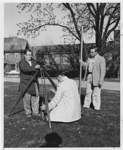 Men using equipment to survey