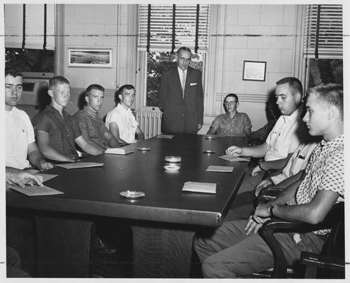 Men in a meeting or class