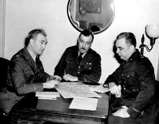 Three National Guardsmen at a table