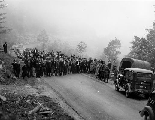 A crowd of miners blocking a road
