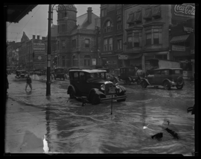 Flood Views; Main Street ; Storefronts in background; Postal                             Telegraph-Cable Company, 205 East Main; Morris Shoe Repairing, 209 East                             Main; Johns Drug Company, 203 East Main