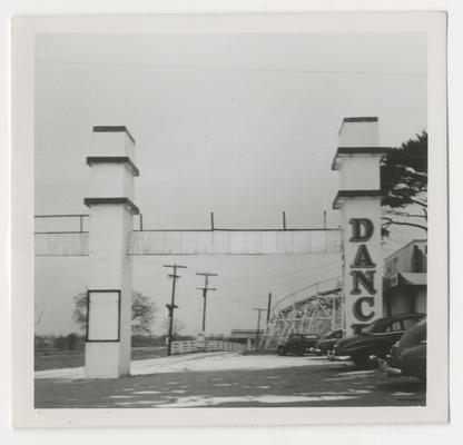 Dance Swim Play amusement facility, Joyland Park; front pillar entrance view from right, rollercoaster in background