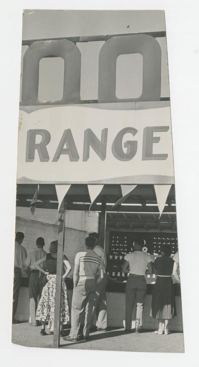 People standing in line for the shooting range and watching, amusement facility, Joyland Park