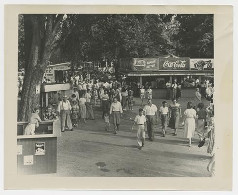 Pepsi Cola Bigger Better Coca Cola Stand, people walking down walkway, Joyland Park - stamped on back of photograph Battaile's Portrait and Bridal Studio 429 West Second St. Lexington 7, Ky