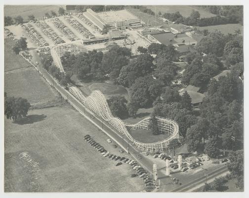 Aerial view of Joyland Park with roller coaster and parking lot with cars, Joyland Park - stamped on back of photograph Battaile's Portrait and Bridal Studio 429 West Second St. Lexington 7, Ky