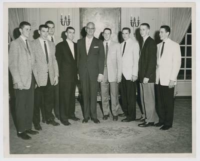 Basketball players with athletic director Bernie Shively